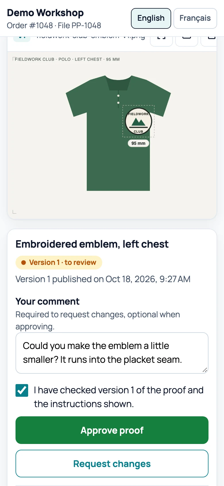 The same page with the customer's comment typed in: “Could you make the emblem a little smaller? It runs into the placket seam.” and the confirmation box ticked.
